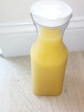 clear plastic round juice pitchers